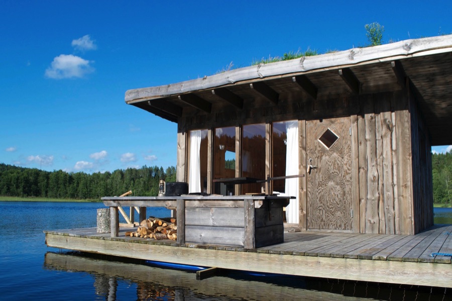 Wooden cabin floating in lake